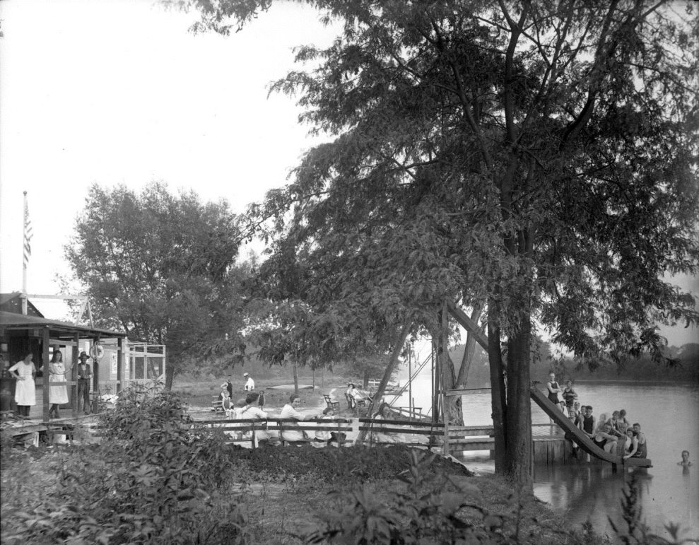  Picture of picnic with people, adults and children, near the Conodoquinet Creek at Bellaire Park.